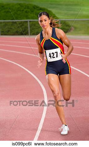 Female athlete running on track View Large Photo Image Stock Image - Female athlete running on track. Fotosearch