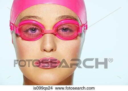 Female swimmer wearing pink swimming goggles View Large Photo Image Picture - Female swimmer wearing pink swimming goggles. Fotosearch