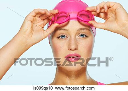Female swimmer with pink goggles and cap View Large Photo Image Stock Image - Female swimmer with pink goggles and cap. Fotosearch