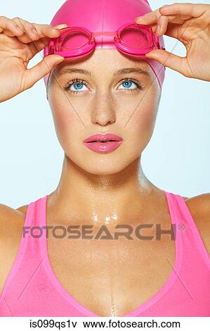 Female swimmer with pink goggles and cap View Large Photo Image Stock Photo - Female swimmer with pink goggles and cap. Fotosearch