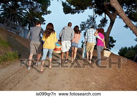 Picture - Friends walking back from beach. Fotosearch