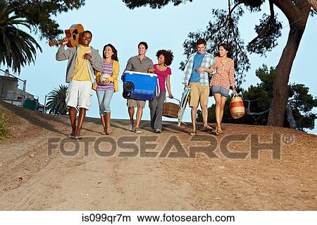 Picture - Friends walking to beach. Fotosearch