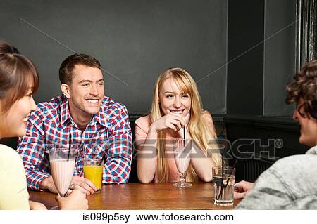 Stock Photo - Friends with soft drinks. Fotosearch
