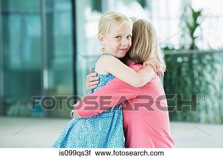 Girl and grandmother in embrace View Large Photo Image Stock Image - Girl and grandmother in embrace. Fotosearch