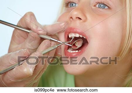 Girl having dental check up View Large Photo Image Stock Image - Girl having dental check up. Fotosearch
