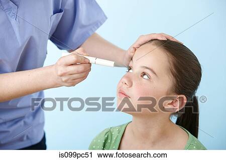 Girl having eye test View Large Photo Image Stock Image - Girl having eye test. Fotosearch