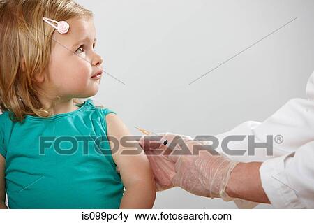 Girl having injection View Large Photo Image Stock Photo - Girl having injection. Fotosearch