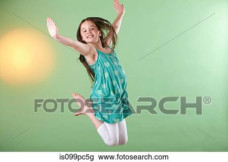 Girl jumping, mid air View Large Photo Image Stock Image - Girl jumping, mid air. Fotosearch