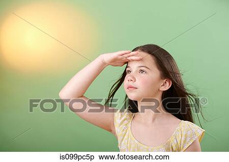 Girl shielding eyes View Large Photo Image Stock Photography - Girl shielding eyes. Fotosearch