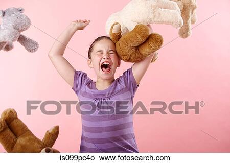 Girl throwing teddy bears View Large Photo Image Picture - Girl throwing teddy bears. Fotosearch