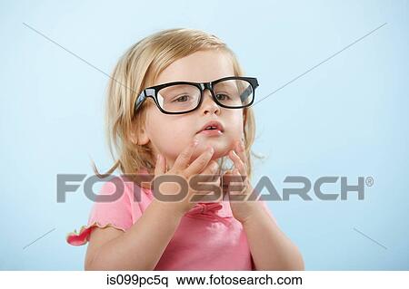 Girl wearing eyeglasses View Large Photo Image Stock Photography - Girl wearing eyeglasses. Fotosearch