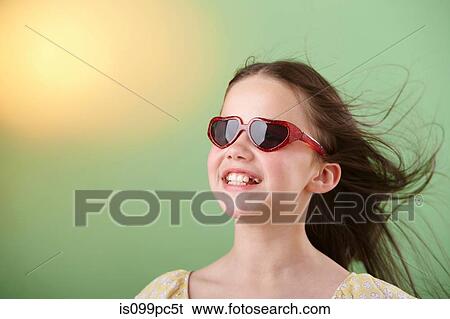 Stock Photograph - Girl wearing sunglasses. Fotosearch