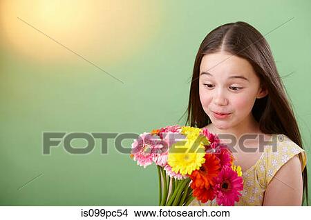 Girl with bunch of flowers View Large Photo Image Picture - Girl with bunch of flowers. Fotosearch