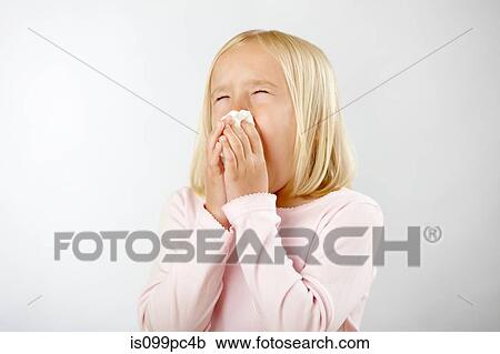 Girl with cold blowing nose View Large Photo Image Stock Image - Girl with cold blowing nose. Fotosearch