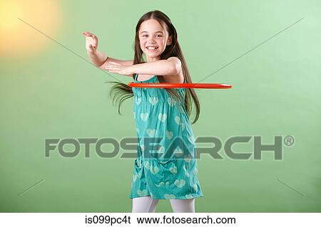 Stock Photograph - Girl with plastic hoop. Fotosearch
