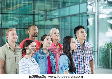 Group of people looking up View Large Photo Image Stock Photography - Group of people looking up. Fotosearch
