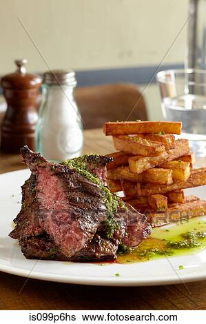 Stock Photograph - Hanger steak and fries. Fotosearch