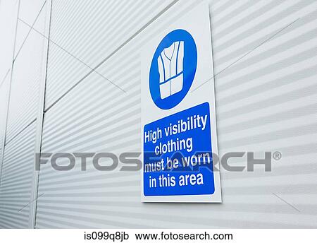 High visibility clothing sign on warehouse door View Large Photo Image Stock Image - High visibility clothing sign on warehouse door. Fotosearch