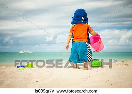Little boy at the beach View Large Photo Image Stock Photo - Little boy at the beach. Fotosearch