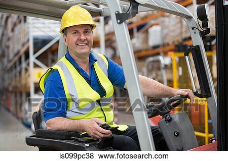 Man driving forklift truck View Large Photo Image Stock Photo - Man driving forklift truck. Fotosearch