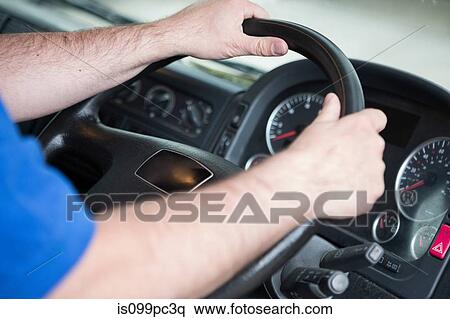 Stock Photography - Man driving truck, close up. Fotosearch