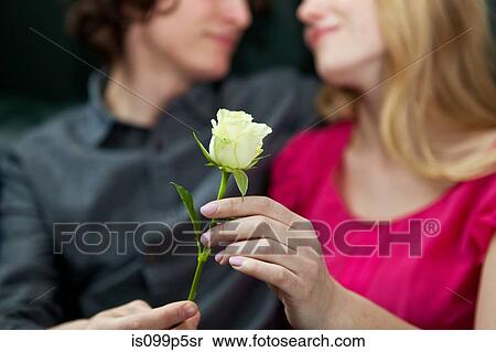 Man giving rose to woman View Large Photo Image Stock Photography - Man giving rose to woman. Fotosearch