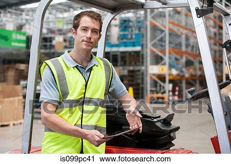 Man sitting with forklift truck, portrait View Large Photo Image Stock Image - Man sitting with forklift truck, portrait. Fotosearch