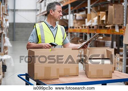 Man using barcode reader in warehouse View Large Photo Image Picture - Man using barcode reader in warehouse. Fotosearch