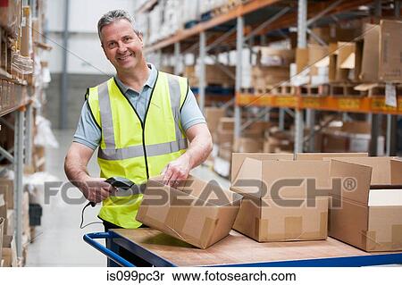 Man using barcode reader in warehouse View Large Photo Image Stock Photography - Man using barcode reader in warehouse. Fotosearch