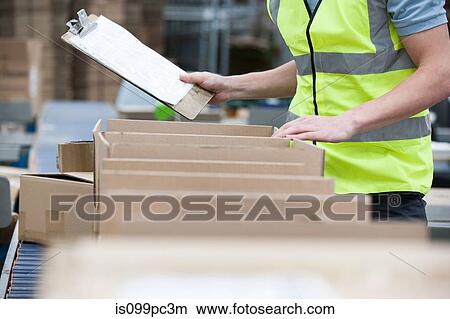 Man with clipboard checking stock View Large Photo Image Picture - Man with clipboard checking stock. Fotosearch