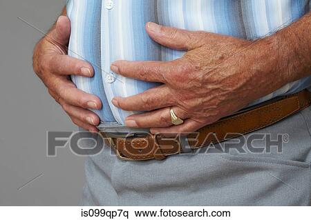 Overweight senior man touching stomach View Large Photo Image Stock Photography - Overweight senior man touching stomach. Fotosearch