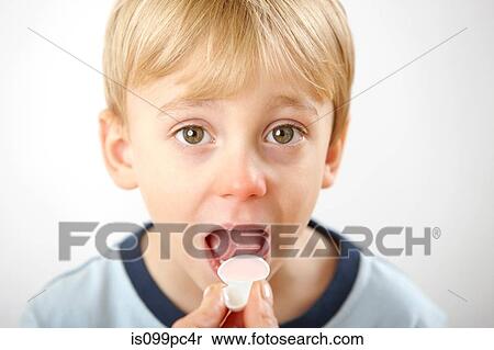 Parent giving son medicine View Large Photo Image Stock Photography - Parent giving son medicine. Fotosearch