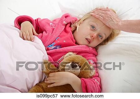 Parent touching girl's forehead View Large Photo Image Stock Photo - Parent touching girl's forehead. Fotosearch