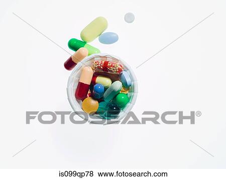 Pills in a cup View Large Photo Image Stock Photo - Pills in a cup. Fotosearch