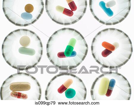 Pills in dispenser cups View Large Photo Image Stock Photo - Pills in dispenser cups. Fotosearch