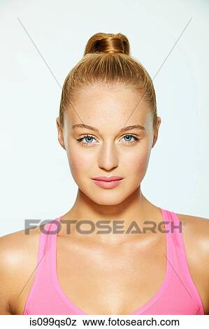 Stock Photo - Portrait of a beautiful young woman with hair up. Fotosearch