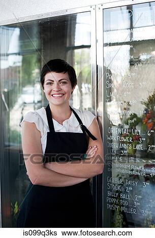 Stock Photograph - Portrait of florist, arms crossed. Fotosearch