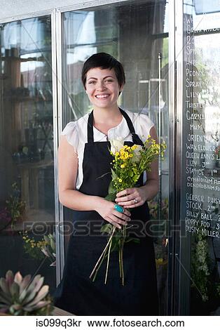 Portrait of florist holding bunch of flowers View Large Photo Image Stock Photography - Portrait of florist holding bunch of flowers. Fotosearch
