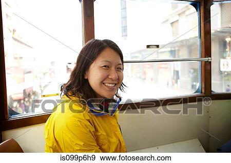 Portrait of woman in tram View Large Photo Image Stock Photo - Portrait of woman in tram. Fotosearch