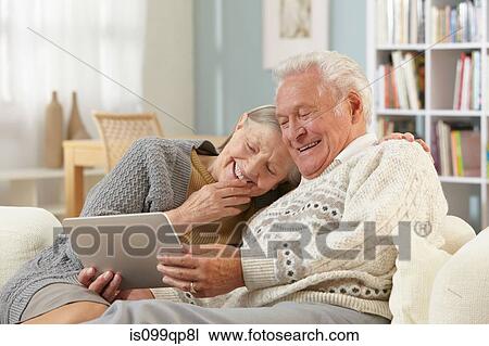 Senior couple with digital tablet View Large Photo Image Stock Image - Senior couple with digital tablet. Fotosearch