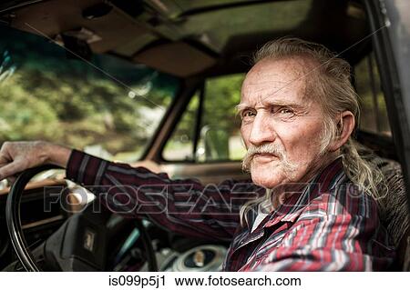 Senior man inside car View Large Photo Image Stock Image - Senior man inside car. Fotosearch