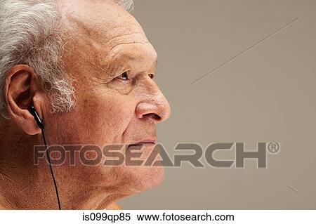 Senior man wearing earphones, portrait View Large Photo Image Stock Photography - Senior man wearing earphones, portrait. Fotosearch
