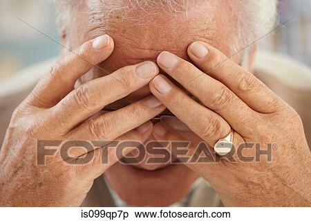 Senior man with head in hands, close up portrait View Large Photo Image Stock Photography - Senior man with head in hands, close up portrait. Fotosearch