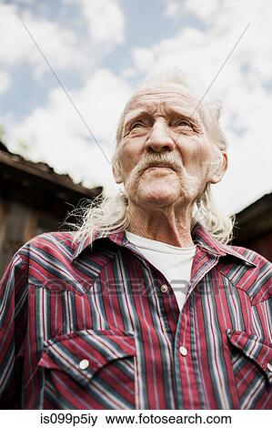 Senior man with long grey hair, portrait View Large Photo Image Stock Photo - Senior man with long grey hair, portrait. Fotosearch