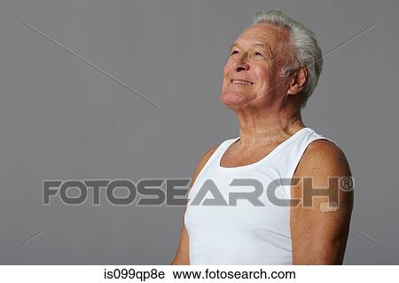 Senior man with plaster on arm View Large Photo Image Stock Image - Senior man with plaster on arm. Fotosearch