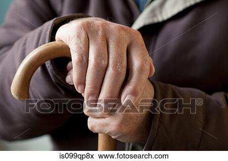 Senior man with walking stick, close up View Large Photo Image Stock Photo - Senior man with walking stick, close up. Fotosearch