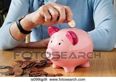 Senior woman inserting coins into piggybank View Large Photo Image Stock Image - Senior woman inserting coins into piggybank. Fotosearch