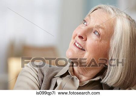 Stock Image - Senior woman looking away, portrait. Fotosearch
