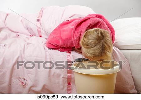 Sick girl with bucket View Large Photo Image Stock Photo - Sick girl with bucket. Fotosearch