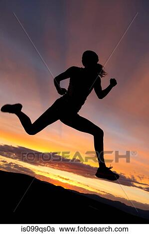 Silhouette of athlete jumping against sunset View Large Photo Image Stock Image - Silhouette of athlete jumping against sunset. Fotosearch